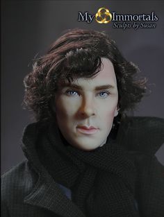 a close up of a doll wearing a black coat