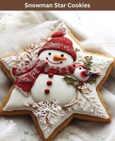 a snowman star cookie decorated with icing