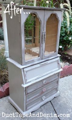 an old dresser has been painted gray and is being used as a planter for plants