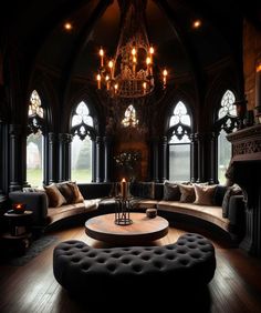 a living room filled with lots of furniture next to large windows and chandelier