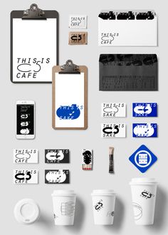 various coffee cups and clipboards are arranged on a gray background with the words this is cafe