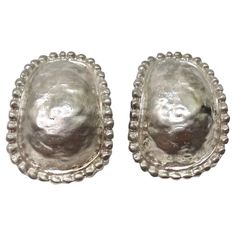 Make a statement with these incredible 1980s sterling silver stud earrings. Oval clip-on studs are adorned in a textured sterling silver with a dome-like structure surrounded by circular engravings. These are such a classic and versatile style of earring, ideal for any occasion as you can dress them up or down to your liking. Style these with a silver Chanel handbag and a vintage Missoni dress for a timelessly chic look. In excellent vintage condition, please see photos. Silver Earrings Vintage, Vintage Earrings Silver, Missoni Vintage, Vintage Missoni, Vintage Silver Earrings, Silver Jewlery, Missoni Dress, Vintage Silver Jewelry, Clip On Earring