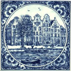 a blue and white plate with buildings on it