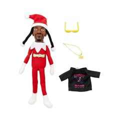 an elf doll is next to a black shirt