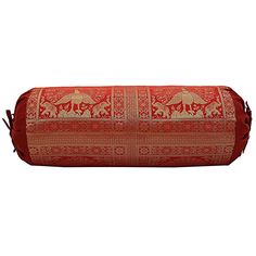 a large red and gold pillow on a white background with an intricate design in the middle