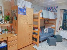 a room with bunk beds and furniture in it