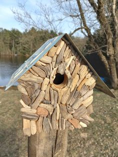 a bird house made out of wood sticks