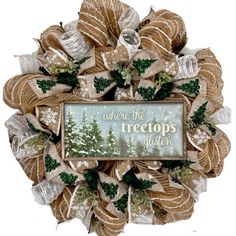 a christmas wreath with ribbons and a sign on the front that says where the trees are