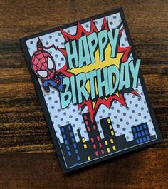 a birthday card with the words happy birthday written in bright colors and an image of a spiderman