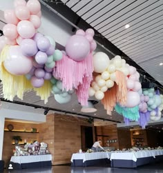 balloons and streamers are hanging from the ceiling