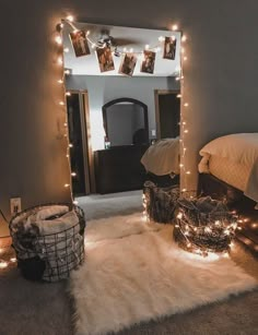 a bedroom decorated with lights and pictures on the wall