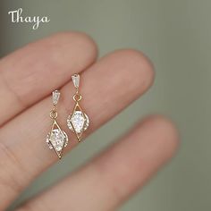 Elevate your style with Thaya's Sterling Silver Earrings, featuring gemstones and diamond accents. Crafted from high-quality 925 silver or 14k gold plated, these earrings are perfect for any woman who loves elegant and sophisticated jewelry. The diamonds add a touch of sparkle, while the inlay material of sterling silver and gemstones enhances their durability and beauty. With a weight of just 1.5g, these earrings are comfortable for everyday wear. The process of diamonds ensures their quality a Teardrop Bridal Earrings, Stud Earrings Women, Earrings Women, Party Jewelry, Gold Earrings Dangle, 925 Sterling Silver Earrings, Ear Jewelry, Bridal Earrings