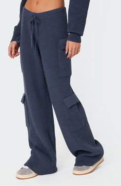 These high-rise sweater-pants feature cargo-style patch pockets and a relaxed profile ideal for off-duty days. Elastic/drawstring waist Cargo flap-patch pockets 50% polyester, 50% rayon Machine wash, dry flat Imported Cargo Pants Women, Navy Blue Color, Sweater Pants, Tracksuit Bottoms, Knit Pants, Drawstring Pants, Womens Sweatpants, Bottoms Pants, Drawstring Waist