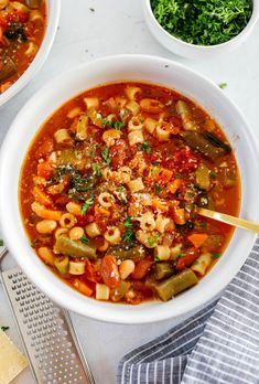 two bowls filled with pasta and vegetable soup