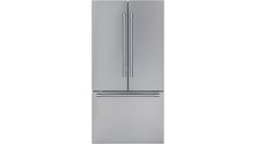 a silver refrigerator freezer sitting next to a white wall