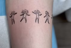 three people with flowers on their arms are depicted in this tattoo style photo taken from the waist up