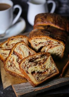 sliced cinnamon swirl bread sitting on top of a cutting board