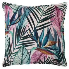 an image of a pillow with tropical leaves on the front and back cover in blue, pink