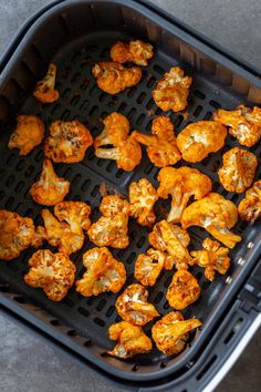 cooked cauliflower in an air fryer basket