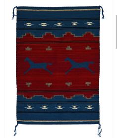 a red and blue rug with two horses on the front, one horse running across it