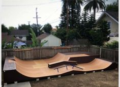 a skateboard ramp in the middle of a yard