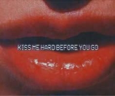 the words kiss me hard before you go are written in white on a red lip