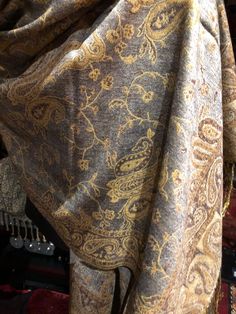 Gray and beige Vintage styled wrap 28 X 70 Nice brocade paisley Very soft silk blend Styled from ancient Jamawar Indian motifs These are replicated from vintage shawl collections by my own company We may have larger quantities available for weddings, bridesmaids, or wholesale orders. Please inquire. All shipped free in the US Please check out our THOUSANDS of great reviews Silk Shawl With Paisley Print In Vintage Style, Vintage Silk Pashmina Shawl With Paisley Print, Festive Vintage Paisley Print Pashmina Shawl, Vintage Paisley Print Pashmina Shawl, Vintage Paisley Print Pashmina Scarf, Vintage Shawls, Pashmina Scarf, Grey And Beige, Ethiopia