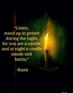 a lit candle sitting on top of a table next to a quote from rumi