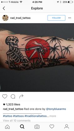 a person with a tattoo on their arm holding up a red heart and two skeletons