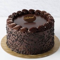 a chocolate cake sitting on top of a table