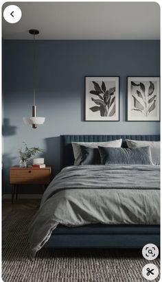 a bedroom with blue walls and grey bedding