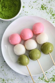 green and pink marshmallows on a white plate