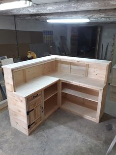 an unfinished workbench is being built in a garage