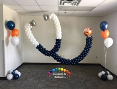 an office decorated with balloons and streamers