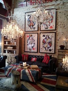 a living room filled with furniture and lots of chandelier hanging from the ceiling