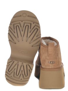 Boots UGG "Classic Ultra Mini New Heights" made of suede leather in Camel color. Fabric edge. Round toe. Foam insole. Rear pull tab. "UGG" logo patch applied on the back. EVA rubber sole. Platform height 7cm Sole 100% Rubber 100% LeatherComposition: Leather Beige Leather Boots With Cushioned Footbed, Beige Suede Boots With Cushioned Footbed, Classic Ugg Boots, Ugg Classic Ultra Mini, Boots Ugg, Gucci Hat, Sheepskin Boots, Ugg Classic, Color Fabric