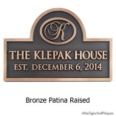 a sign that says the kelpak house est december 6, 2014 bronze patina raised