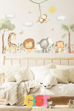 a child's bedroom with jungle animals and trees on the wall