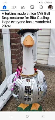 a fake duck wearing a disco ball costume for rio goslinging hope everyone has a wonderful holiday