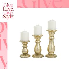 three gold candles sitting next to each other on a pink and white background with the words give love, give style