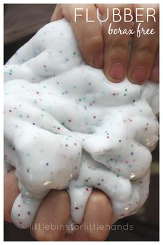 a person holding a fake white substance with sprinkles on it's hands