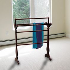 a towel rack in front of a window