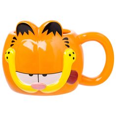 a close up of a cup shaped like a tiger