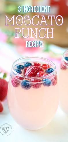 two glasses filled with liquid and topped with berries