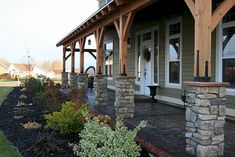 an outside view of a house with stone pillars