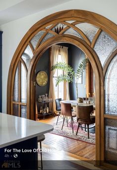 an arched doorway leads into the dining room