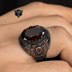 "Red Garnet Silver Ring, Best Men Accessory, Handmade Ring, 925 Sterling Silver, Fashion Ring, Vintage Men Jewelry to Dad ✦ Details ✦ * Material: 925 Sterling Silver * Gemstone: Garnet * Weight: 18.00 grams * Sides oxidized, decorated with Garnet stones and Micro zircon stones. * Stamp: 925 * Available sizes; 5 US to 16 US. Contact me if you need any other size! ✦ Shipping ✦ * Processing time: 1-3 business days. * This item ships from my Turkish workshop in Istanbul. * Add your phone number in address box for a smoother delivery. That makes courier personnel's job easier.  ✦ Packaging ✦ * Comes with a luxury gift box and a jewellery cleaning cloth and courtesy gift. ✦ Returns, Exchanges ✦ * Return option available for 30 days after the delivery. * The product has to be in the same shape, t Men Accessory, Man Rings, Turkish Rings, Mens Rings Fashion, Men Jewelry, Garnet Stone, Fashion Ring, Red Garnet, Ring Vintage