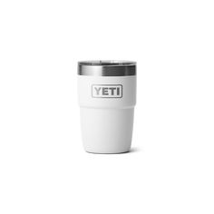 a white yeti cup with the word yeti on it's front and side