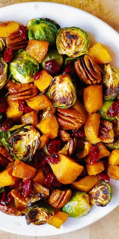 brussel sprouts and brussels sprouts with pecans in a white bowl