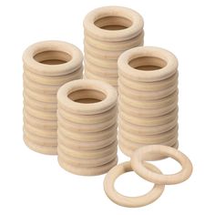 several wooden rings and o - rings on a white background